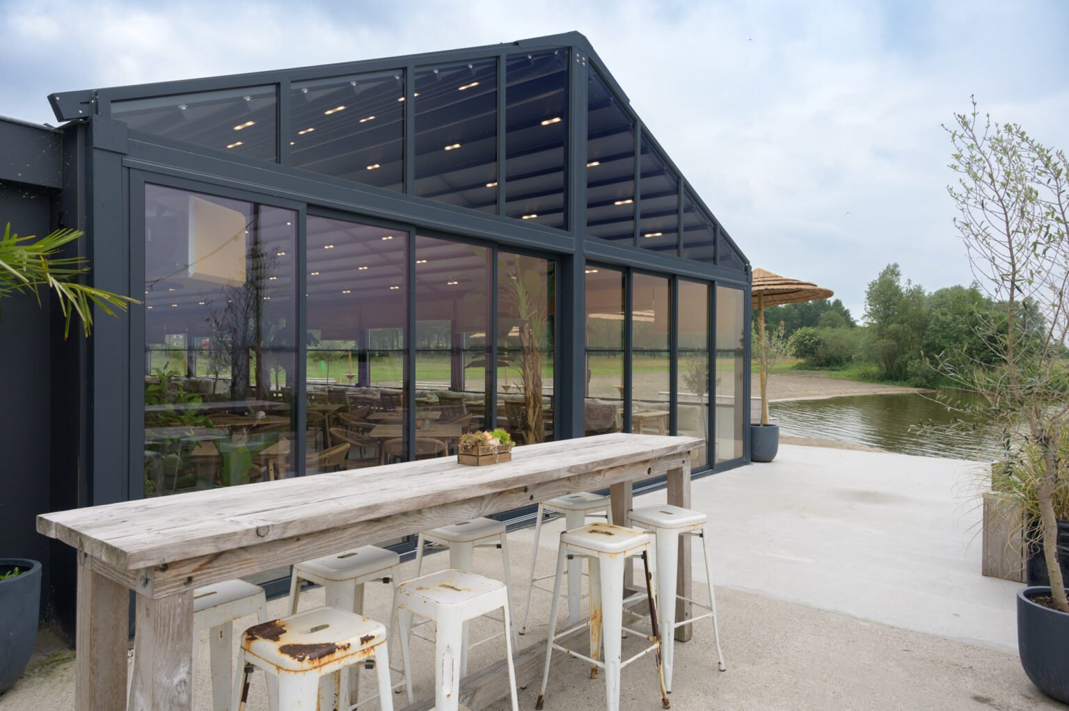 Restaurant enclosed with double-glazed sliding glass walls